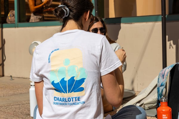 Volunteer with a Charlotte Surfrider Shirt 