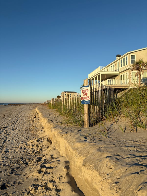 A beach with a view of the sand and the sky.